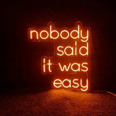 Orange nobody said it was easy LED neon sign, perfect for any room, colorful LED neon sign, get in touch for any custom LED neon sign enquiries you may have, London neon will help you create any custom LED neon sign designs you might have. our LED neon signs are the most affordable on the market and we will price beat any other UK LED neon sign quote. check out our pre made LED neon signs in our LED neon sign store